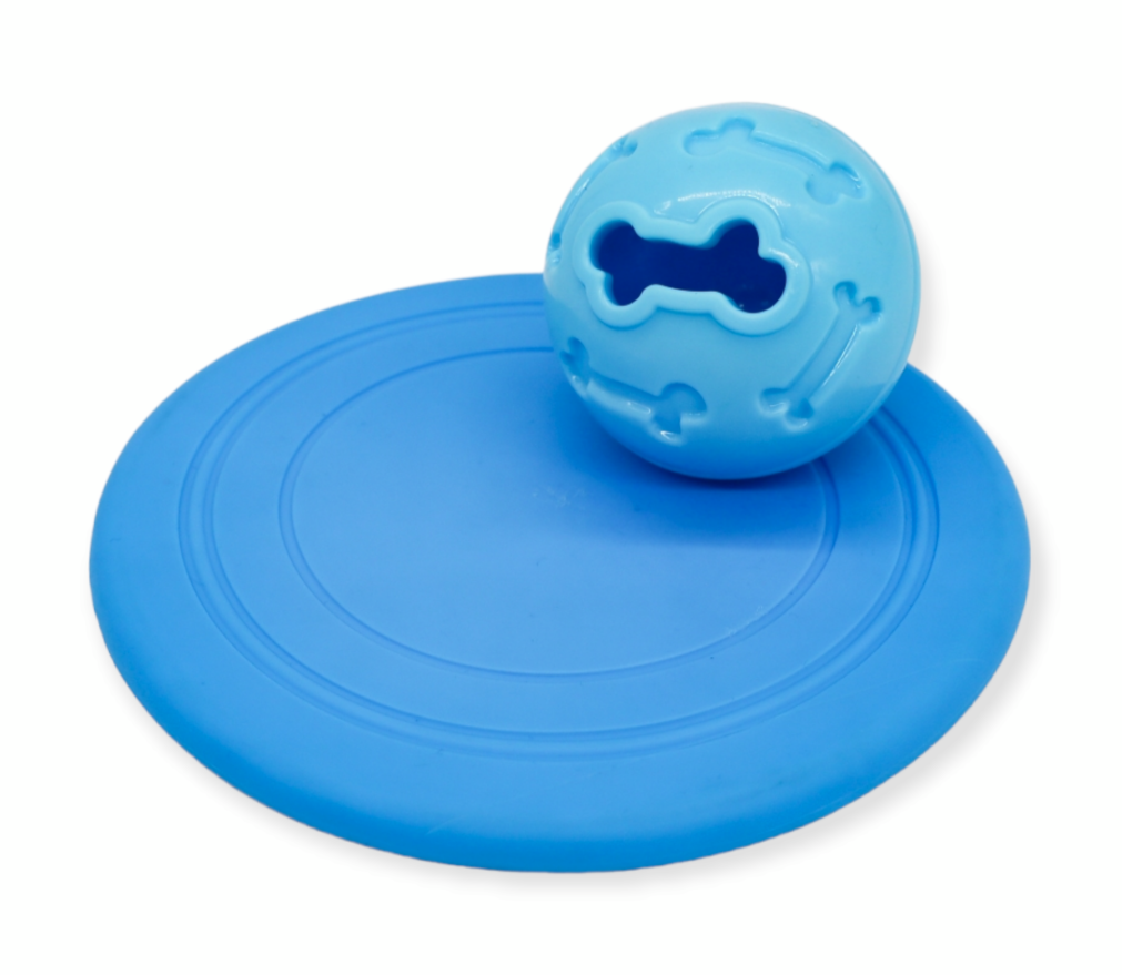 A collection of dog toys including a plush toy, three rope toys, a frisbee, and a treat ball. The toys are designed to relieve boredom and provide entertainment for dogs. This dog toy box is a perfect birthday gift for dog lovers and their furry friends. The toys are brightly colored and made from high-quality materials to ensure durability and long-lasting fun.